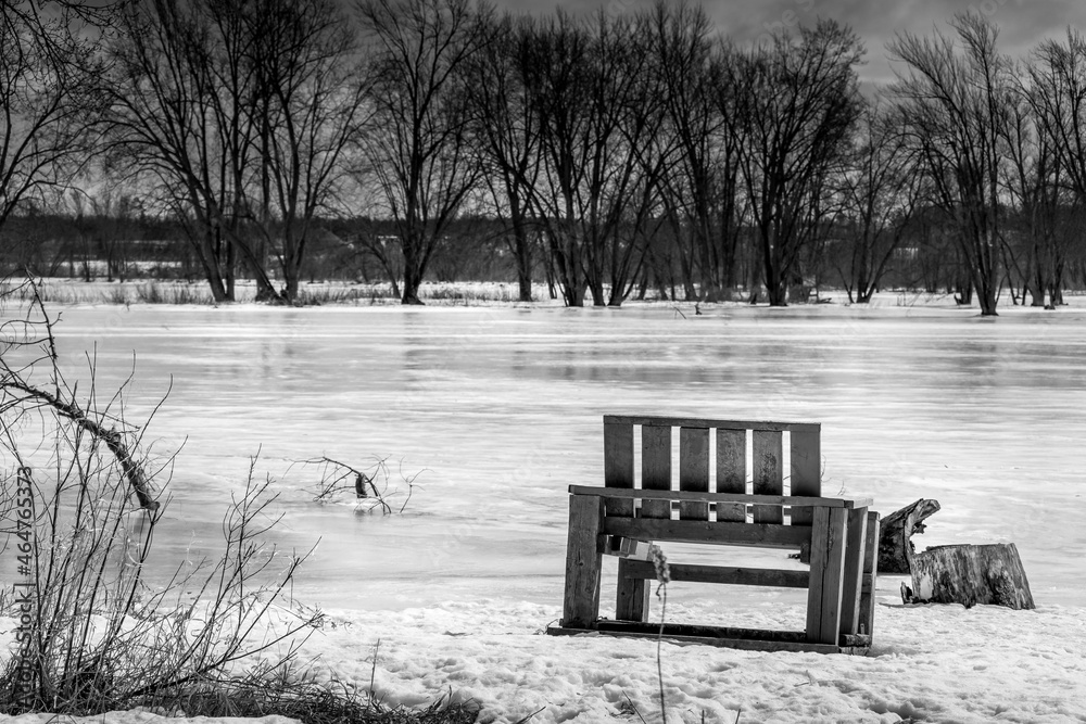 Wooden chair by the frozen Ottawa riverside