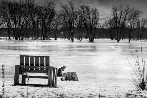 Wooden chair by the frozen Ottawa riverside