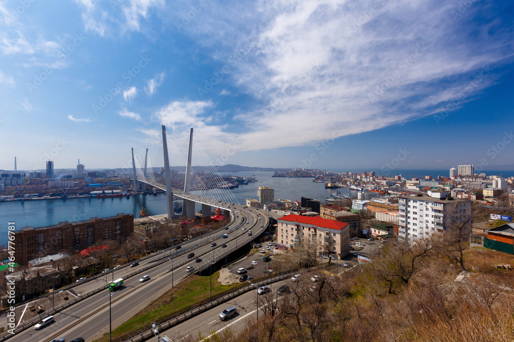Autumn, 2017 - Vladivostok, Russia - Golden Bridge over the Golden Horn Bay in Vladivostok. Cable-stayed bridge in Vladivostok. Cars drive along the roadway of the Golden Bridge.
