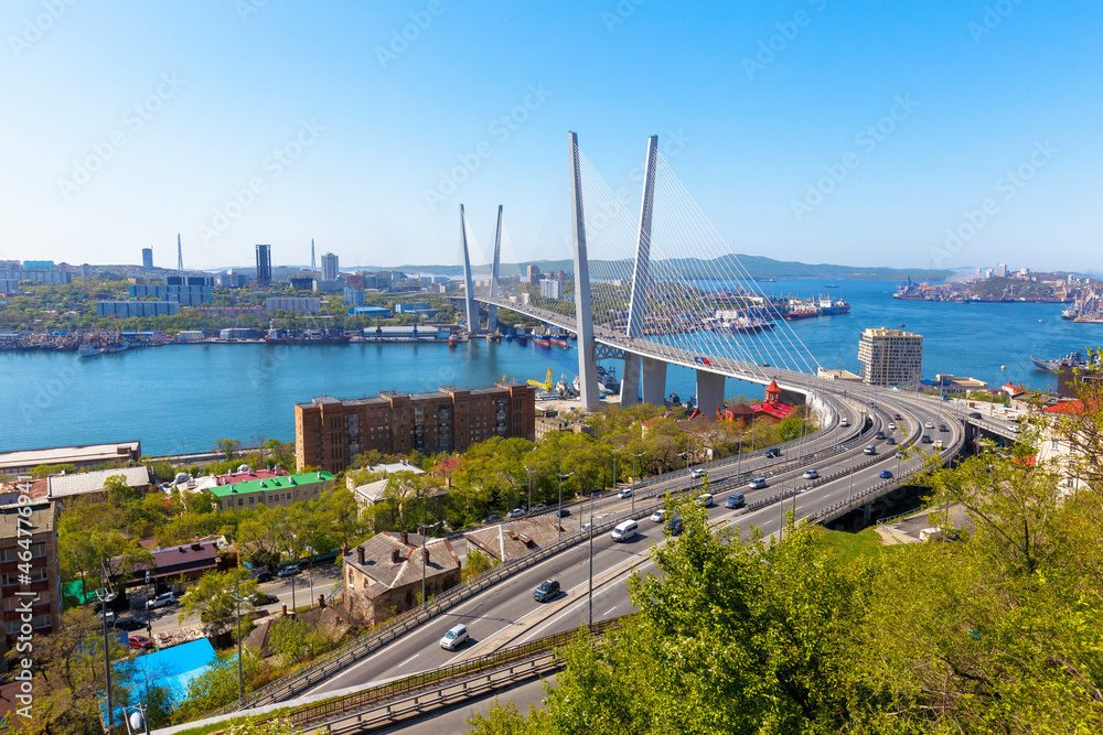 Autumn, 2017 - Vladivostok, Russia - Golden Bridge over the Golden Horn Bay in Vladivostok. Cable-stayed bridge in Vladivostok. Cars drive along the roadway of the Golden Bridge.