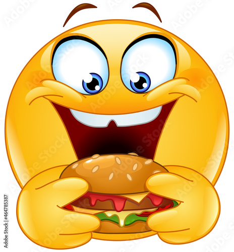 Hungry emoji emoticon eating a vegan burger
