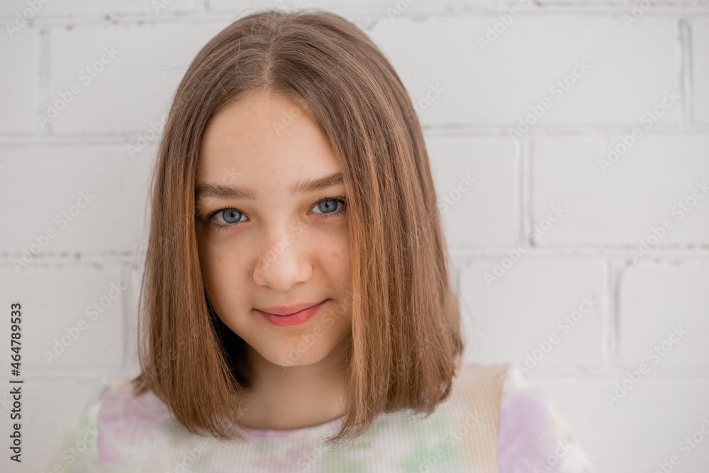 Face of a teenage girl in close up. Teen with problematic skin. Girl with a square hairstyle. Acne and scars. Natural portrait. No makeup and retouch. High quality photo Face of a teenage girl in close up. Teen with problematic skin. Girl with a square hairstyle. Acne and scars. Natural portrait. No makeup and retouch. High quality photo