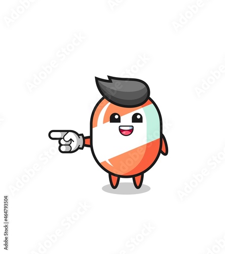 candy cartoon with pointing left gesture