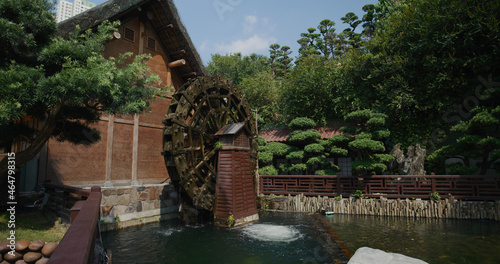 Slika na platnu Water wheel in Traditional chinese style garden