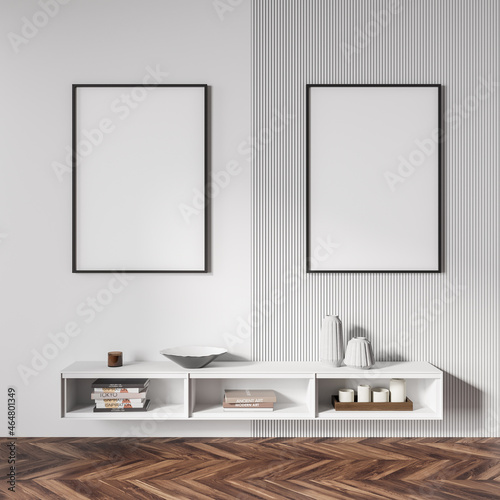 White exhibition room interior with drawer and decoration, two mockup posters