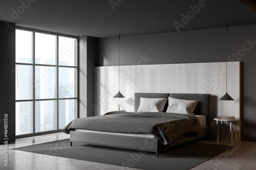 Grey bedroom interior with bed on grey carpet and window with skyscrapers