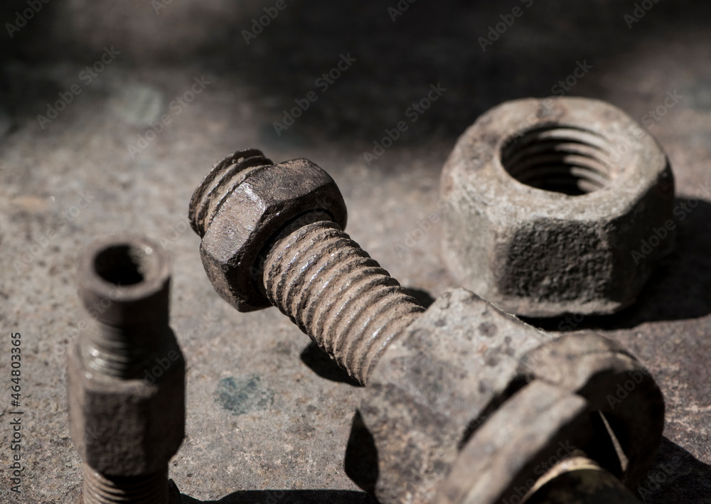 rusty nut. Rusty iron rod with screw threads. Rusted mechanical components. threaded bolt and nut isolated close up. dismantling concept, difficult to unscrew, non-removable. space for text rusty nut. Rusty iron rod with screw threads. Rusted mechanical components. threaded bolt and nut isolated close up. dismantling concept, difficult to unscrew, non-removable. space for text
