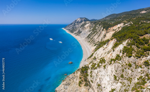 Lefkada, Greece. Remote white Egremni beach with lonely luxury yacht boat on the turquoise colored bay on Ionian Sea © Igor Tichonow