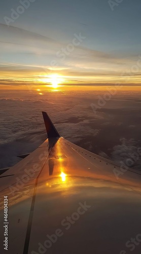 sunset over the clouds view from airplane window