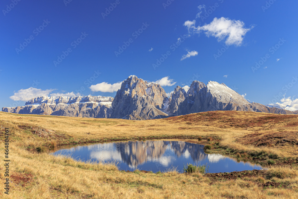 Dolomites reflection, view from Seiser Alm to Sella moutain range with Plattkofel and Langkofel