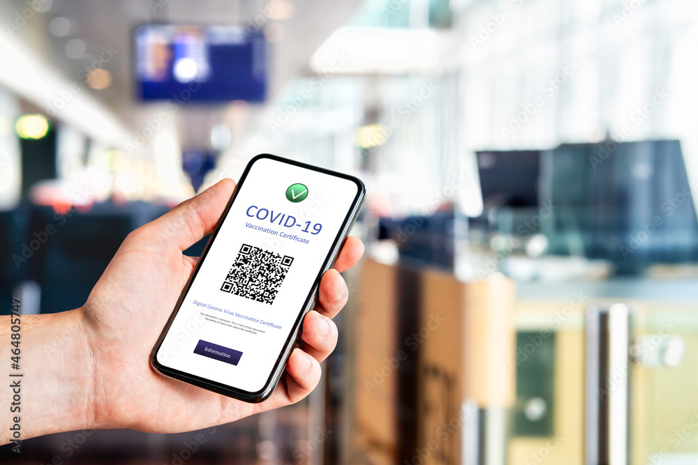 Covid pass certificate at airport. Digital corona virus vaccine document in phone. Electronic proof of coronavirus vaccination. International travel control and check at border for EU coronapass.