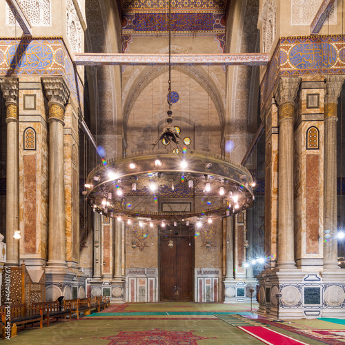 Interior of public historical Al Rifaii Mosque, aka Royal Mosque, suited in Old Cairo, Egypt, with huge marble columns and walls decorated with Arabic calligraphy photo