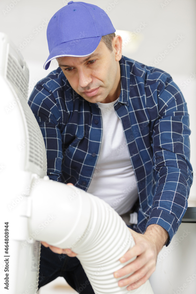 builder installer of ventilation with tools in hands builder installer of ventilation with tools in hands