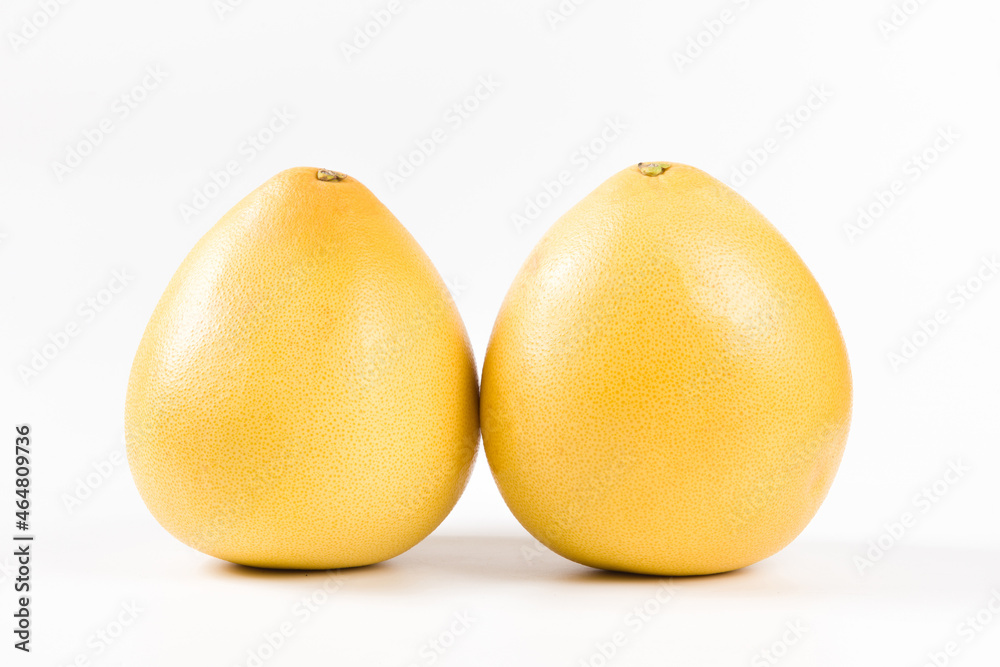 Fresh two yellow pomelo fruit isolated on white background
