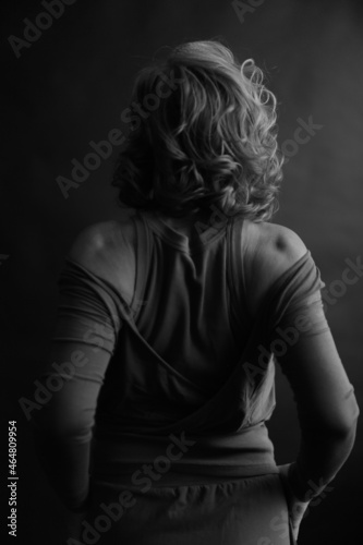 black and white photo shoot, dramatic full-length portrait of a woman, human movements on camera, unfocused and noisy portrait on an old film camera © Наташ Сергеева
