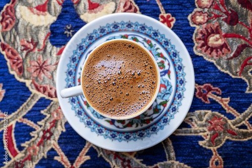 Traditional Turkish coffee, Anatolian coffee, on the table at the old cafe in Turkey. Top view. © Savvapanf Photo ©