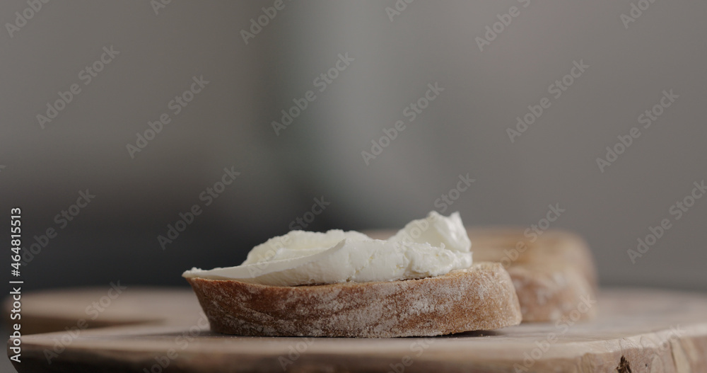 cream cheese on dark ciabatta slice