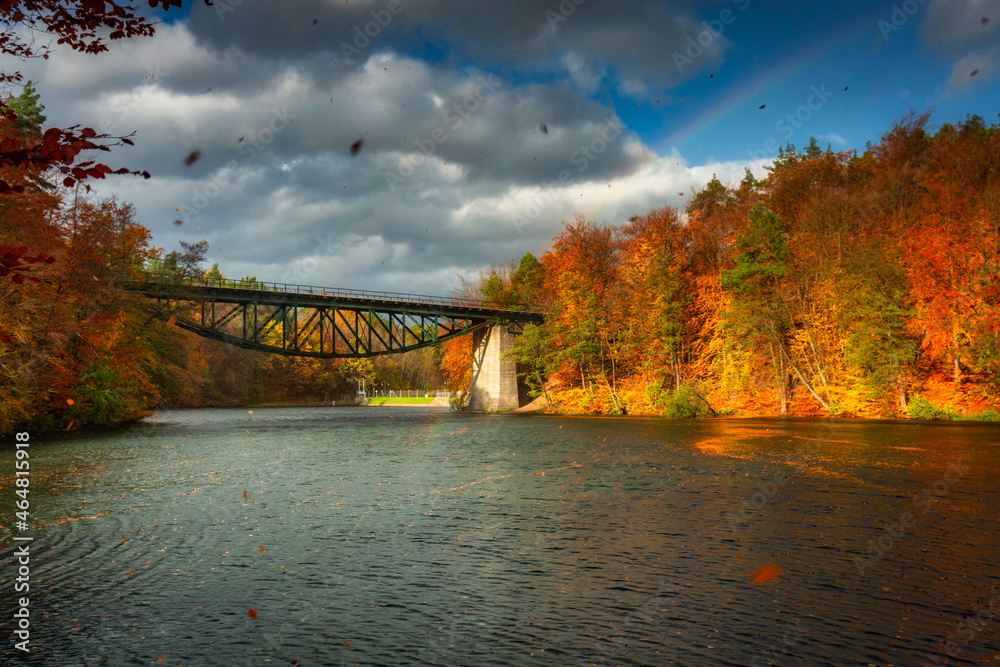 Naklejka premium Autumnal scenery and the railway bridge in Rutki, Kashubia. Poland