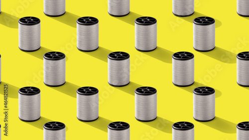 Grey threads spool on yellow background, abstract seamless pattern illustration