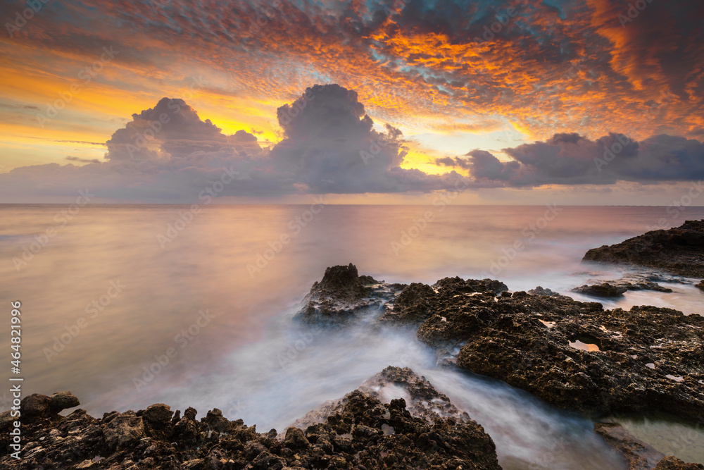 Seascape with a stormy sky during sunrise.