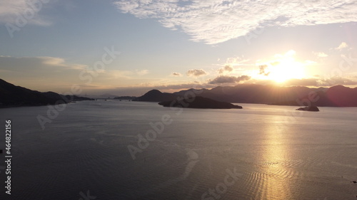 山口県観光地ドローン空撮　朝日の光と瀬戸内海の島々と柳井市の街並み！ photo