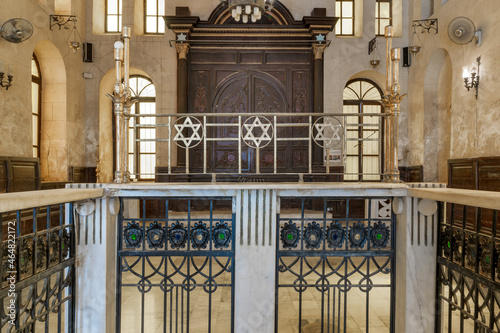 Altar of historic Jewish Maimonides Synagogue or Rav Moshe Synagogue with wooden entrance at the far end, Gamalia district, Cairo, Egypt photo