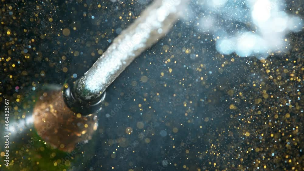 Super slow motion of Champagne explosion with flying cork closure, opening champagne bottle closeup. Filmed on high speed cinematic camera at 1000 frames per second.