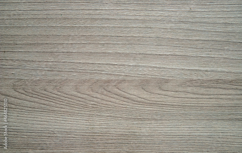 The grey wooden surface is professionally made and fitted. Floor, furniture, table, laminate, parquet. Closeup. 