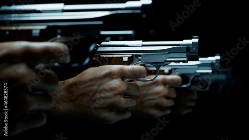 Guns in hands ready to shoot a target.  Shooting practice at the firing range.