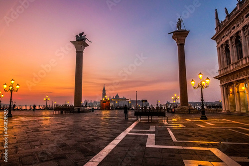 The columns of Saint Mark with his winged lion and Saint Theodore in Venice at dawn