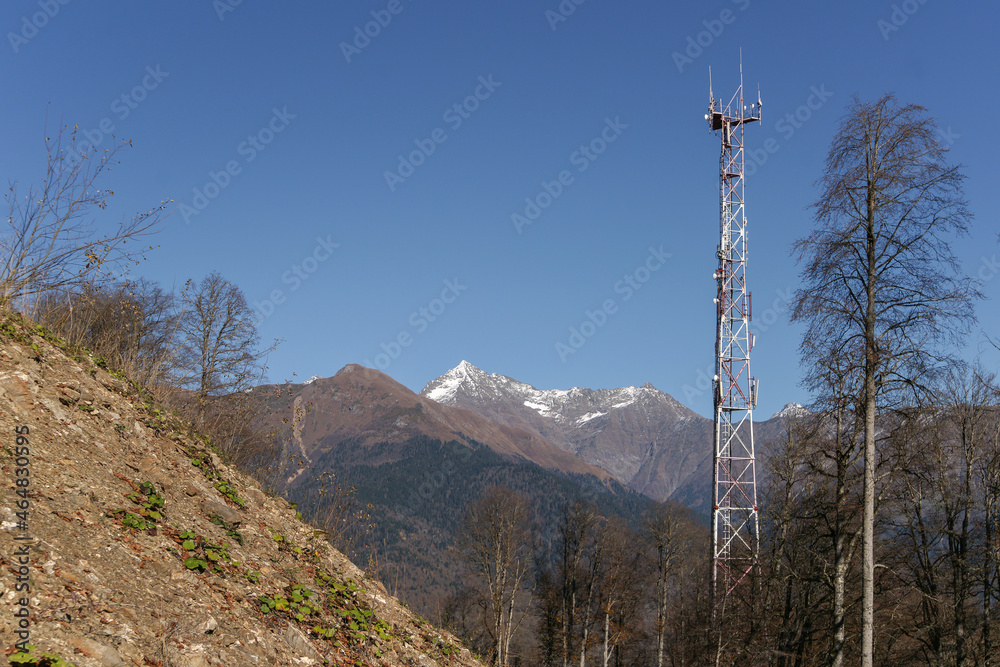 Metal structure in high mountains in the autumn landscape. Wireless telephone connection. Internet. Metal structure in high mountains in the autumn landscape. Wireless telephone connection. Internet.