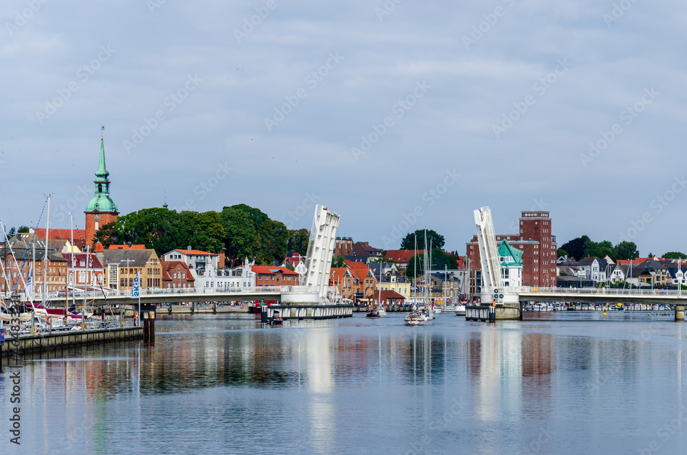 Obraz premium Kappeln, Germany - September 07, 2021: View of the bridge over the Schlei (Schleibrücke Kappeln) and city of Kappeln