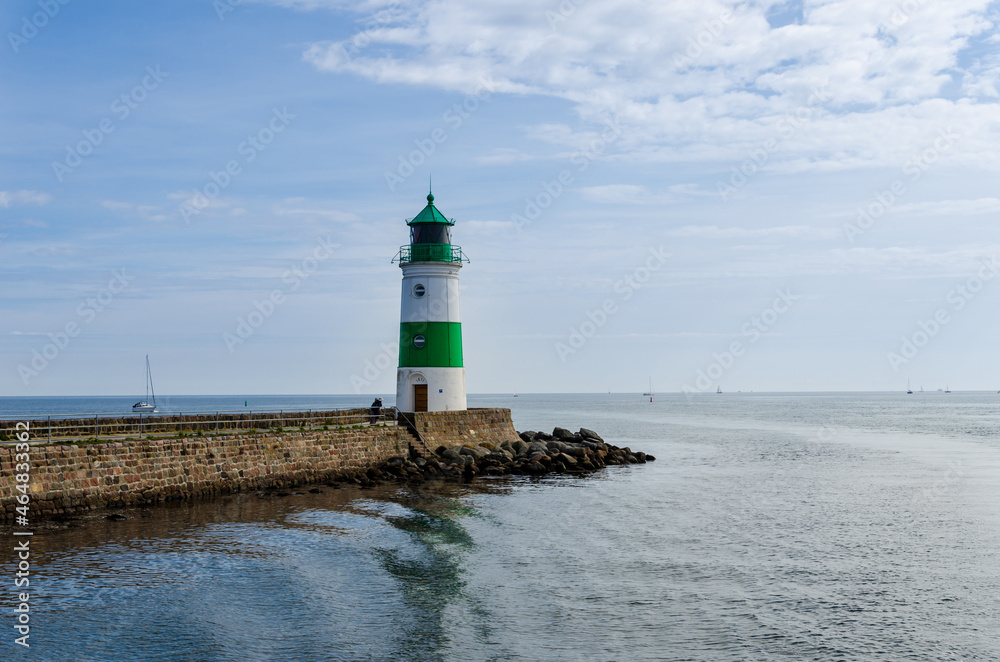 Obraz premium The Lighthouse of Schleimünde at Western coast of Baltic Sea marks the entrance from the sea into the Schlei. The beacon was built in 1871.
