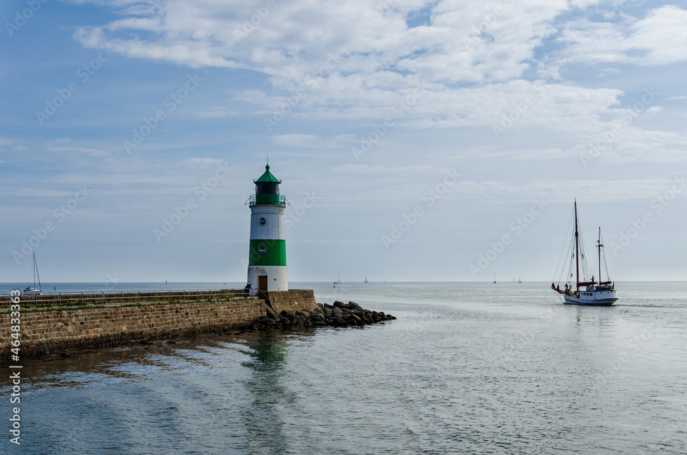 Obraz premium The Lighthouse of Schleimünde at Western coast of Baltic Sea marks the entrance from the sea into the Schlei. The beacon was built in 1871.