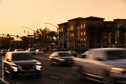 Sunset view of cars passing through the urban core of downtown Rancho Cucamonga, California, USA. © Matt Gush