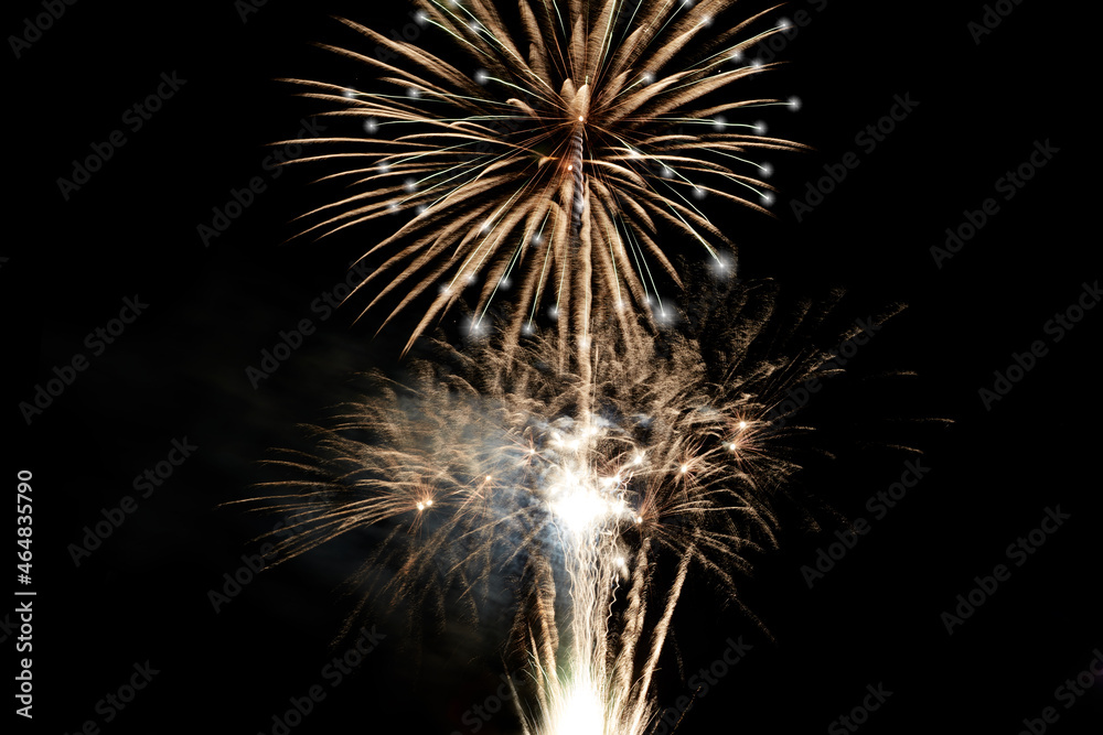 Fireworks display isolated on black with copy space. Pyrotechnic background for greeting card or festival celebration poster. Vertical format Fireworks display isolated on black with copy space. Pyrotechnic background for greeting card or festival celebration poster. Vertical format