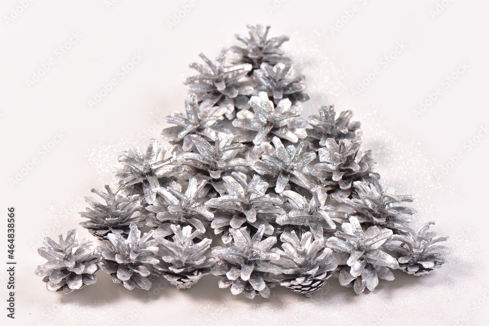 Christmas background of sparkle silver pine cones
