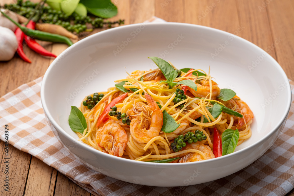Thai fusion food.stir fried pasta with spicy chilli and shrimp mix with green peppercorn Fingerroot and kaffir lime leaves Thai fusion food.stir fried pasta with spicy chilli and shrimp mix with green peppercorn Fingerroot and kaffir lime leaves