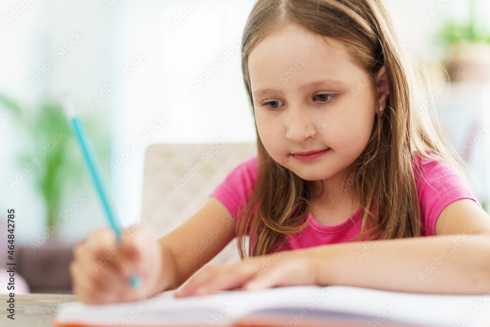 little girl is tired of learning. home schooling, homework. girl rubs his eyes from fatigue reading books and textbooks. little kid student sitting at table with books. vision problems little girl is tired of learning. home schooling, homework. girl rubs his eyes from fatigue reading books and textbooks. little kid student sitting at table with books. vision problems