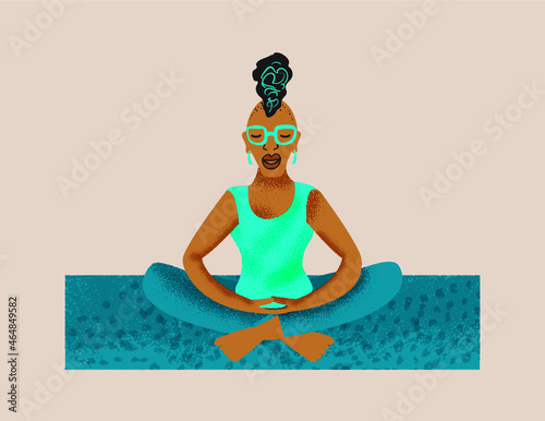 Older lesbian woman mediating on a yoga mat 