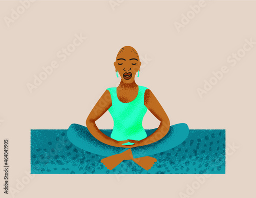 Older lesbian woman mediating on a yoga mat 