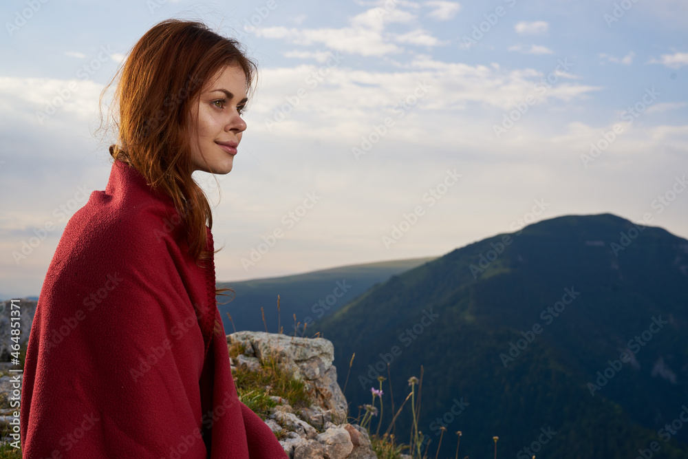 woman with red plaid on nature in the mountains vacation adventure