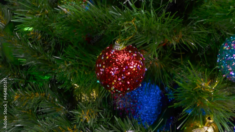 Christmas in motion close-up Christmas tree decorated with colorful balls and lights Christmas in motion close-up Christmas tree decorated with colorful balls and lights
