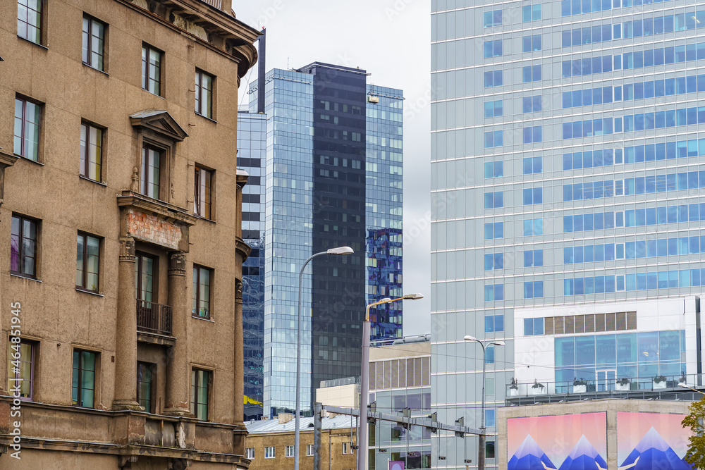 Fototapeta premium Modern glass buildings next to old brick building in central Tallinn Estonia.