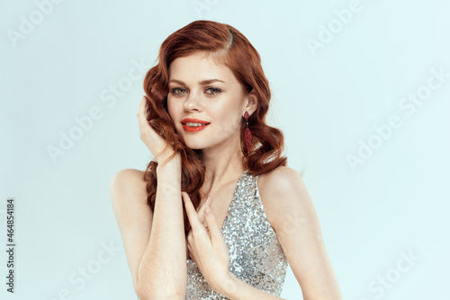 attractive woman redhead posing cosmetics glamor blue background