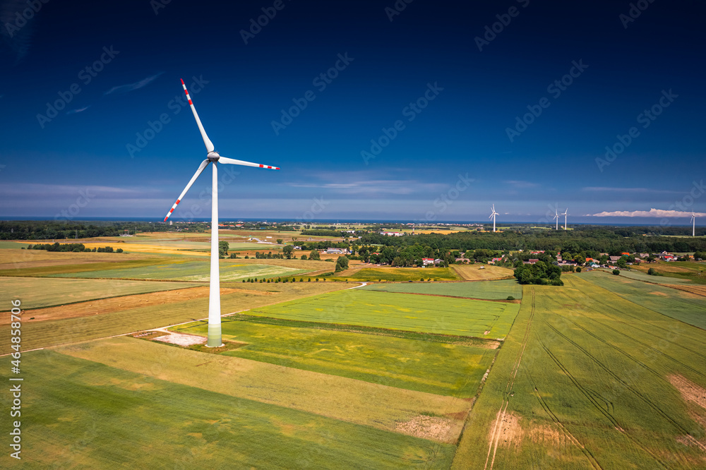 Wind turbine on field before harvest. Agriculture in Poland. Wind turbine on field before harvest. Agriculture in Poland.