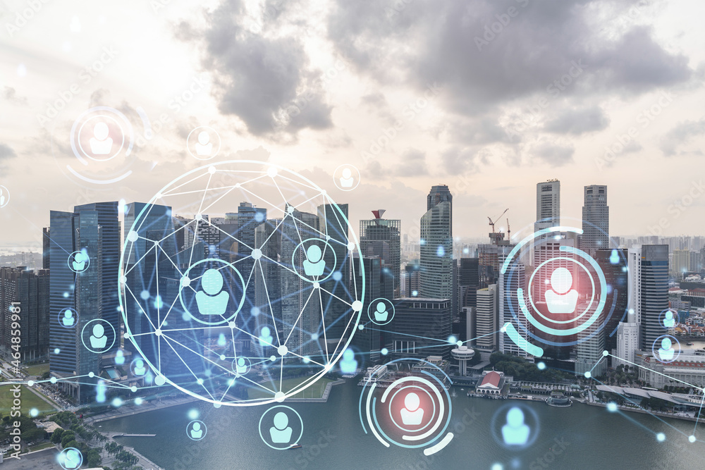 Fototapeta premium Hologram of social media icons over sunset panoramic cityscape of Singapore, Southeast Asia. The concept of people connections and career opportunities in international consulting. Multi exposure.