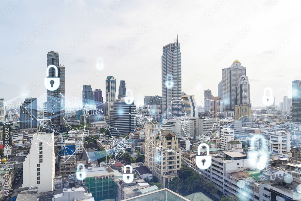 Padlock icon hologram over panorama city view of Bangkok to protect business in Southeast Asia. The concept of information security shields. Double exposure. Padlock icon hologram over panorama city view of Bangkok to protect business in Southeast Asia. The concept of information security shields. Double exposure.