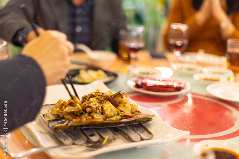 bamboo clams pan fried in special sauce in Chinese seafood restaurant bamboo clams pan fried in special sauce in Chinese seafood restaurant