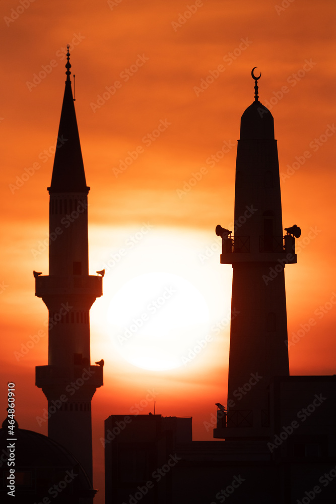 Minarets during sunrise a view from Busiateen coast, Bahrain